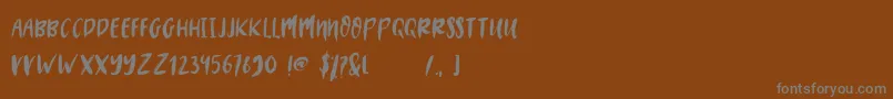 フォントMYSTERY 2019 – 茶色の背景に灰色の文字