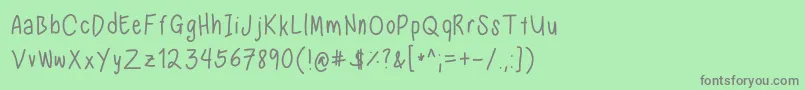 フォントNadezna s handwriting regular – 緑の背景に灰色の文字