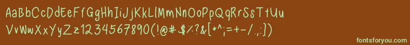 フォントNadezna s handwriting regular – 緑色の文字が茶色の背景にあります。