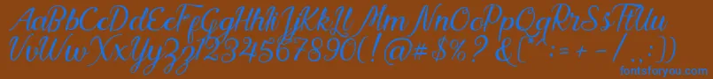 Nadhine Script Free Demo Font – Blue Fonts on Brown Background