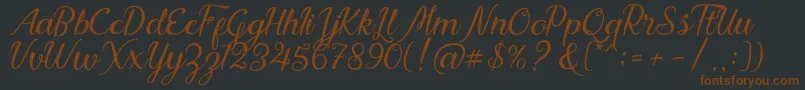 Nadhine Script Free Demo Font – Brown Fonts on Black Background