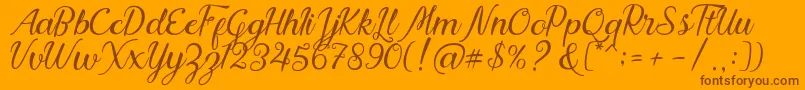 Nadhine Script Free Demo Font – Brown Fonts on Orange Background