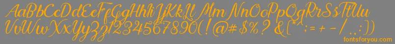 Nadhine Script Free Demo-Schriftart – Orangefarbene Schriften auf grauem Hintergrund