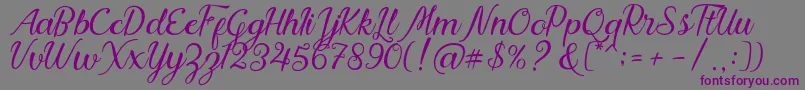 Nadhine Script Free Demo Font – Purple Fonts on Gray Background
