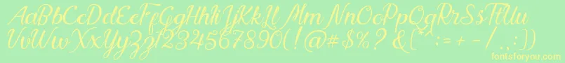 Nadhine Script Free Demo-fontti – keltaiset fontit vihreällä taustalla
