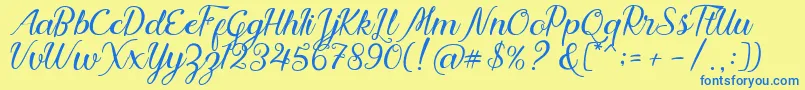 フォントNadhine Script Free Demo – 青い文字が黄色の背景にあります。