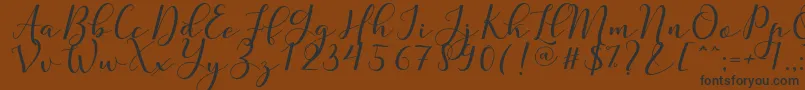 Nafigat Script Font – Black Fonts on Brown Background