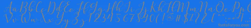 フォントNafigat Script – 青い背景に灰色の文字