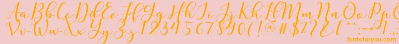 Nafigat Script Font – Orange Fonts on Pink Background
