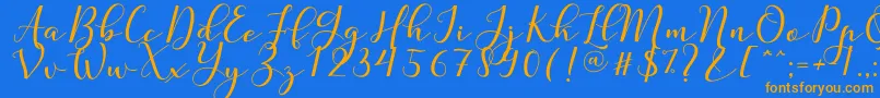 Nafigat Script Font – Orange Fonts on Blue Background