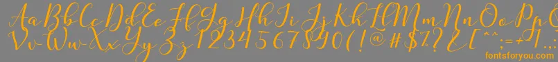 Nafigat Script Font – Orange Fonts on Gray Background