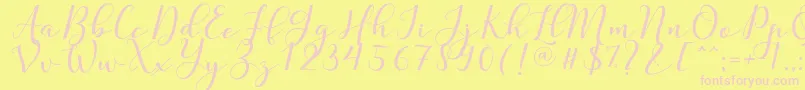 Czcionka Nafigat Script – różowe czcionki na żółtym tle
