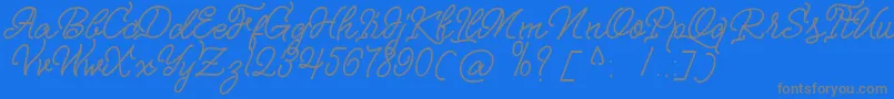 Fonte Nagata Script – fontes cinzas em um fundo azul