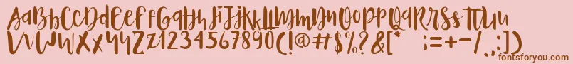 Naira Font – Brown Fonts on Pink Background