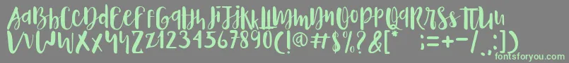 Naira Font – Green Fonts on Gray Background