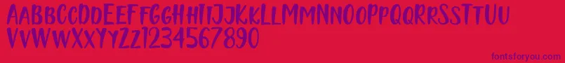 Naishila Caps Font – Purple Fonts on Red Background