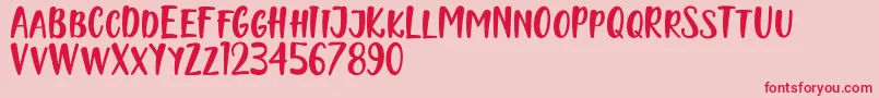 Naishila Caps Font – Red Fonts on Pink Background