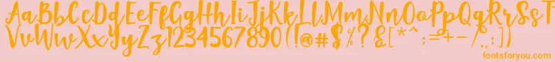 Naishila Dancing Script Font – Orange Fonts on Pink Background