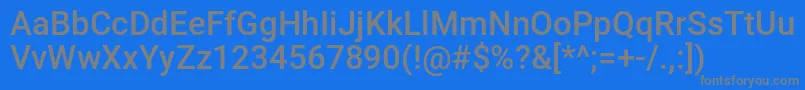 nakdmonk-fontti – harmaat kirjasimet sinisellä taustalla