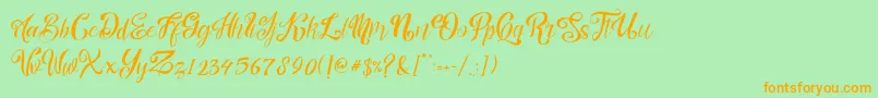 フォントnalicha – オレンジの文字が緑の背景にあります。