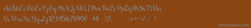 nalytha-fontti – harmaat kirjasimet ruskealla taustalla