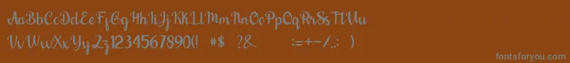 フォントnalytha – 茶色の背景に灰色の文字