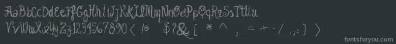 フォントVtksgarotabonita – 黒い背景に灰色の文字