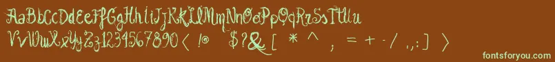 フォントVtksgarotabonita – 緑色の文字が茶色の背景にあります。