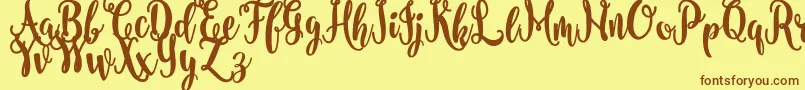 nanda FREE-Schriftart – Braune Schriften auf gelbem Hintergrund