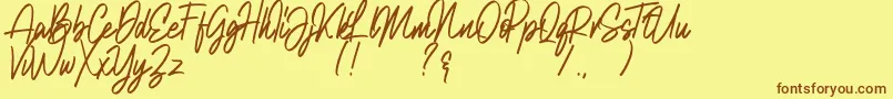 Шрифт Natalia Rosaline Demo – коричневые шрифты на жёлтом фоне
