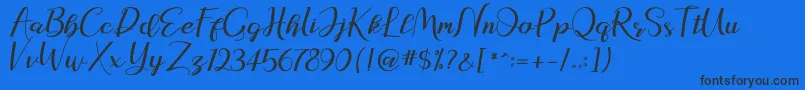 natasya Font – Black Fonts on Blue Background