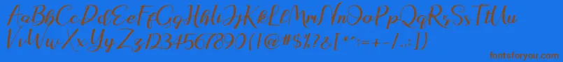 natasya Font – Brown Fonts on Blue Background
