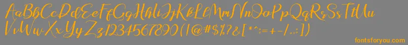 natasya Font – Orange Fonts on Gray Background