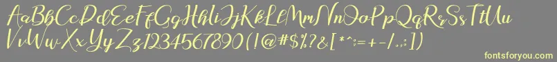 natasya Font – Yellow Fonts on Gray Background
