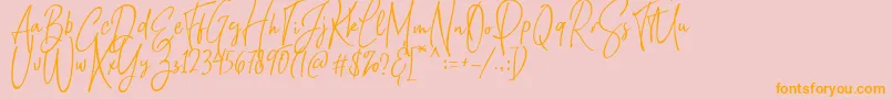 フォントNatthalie Demo – オレンジの文字がピンクの背景にあります。