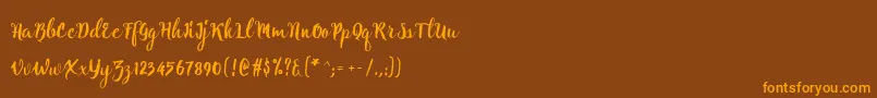 Natural script Free-Schriftart – Orangefarbene Schriften auf braunem Hintergrund