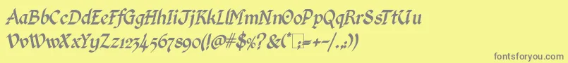 Шрифт KingthingsCalligraphicaItalic – серые шрифты на жёлтом фоне
