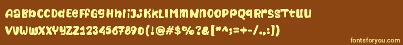 Naturalistic Playground Font – Yellow Fonts on Brown Background