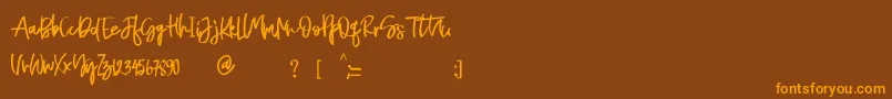 Naycila Font – Orange Fonts on Brown Background