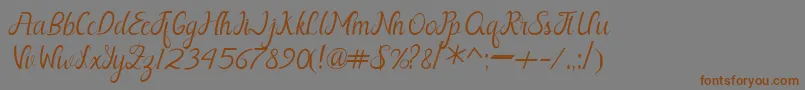 Шрифт Nayla Free – коричневые шрифты на сером фоне