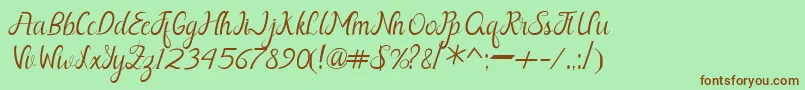 Шрифт Nayla Free – коричневые шрифты на зелёном фоне
