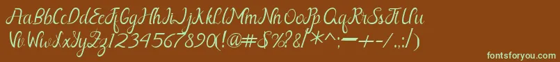 フォントNayla Free – 緑色の文字が茶色の背景にあります。