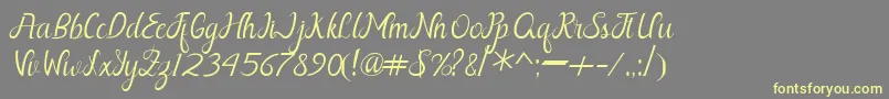 Nayla Free-fontti – keltaiset fontit harmaalla taustalla