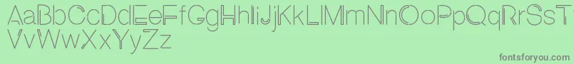 NEON ABSOLUTE SANS1-Schriftart – Graue Schriften auf grünem Hintergrund