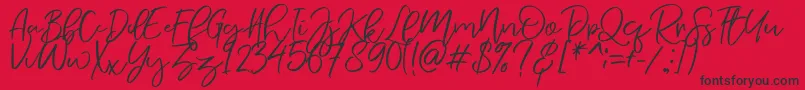 Czcionka NermolaScript Regular – czarne czcionki na czerwonym tle