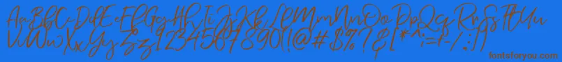 Fonte NermolaScript Regular – fontes marrons em um fundo azul