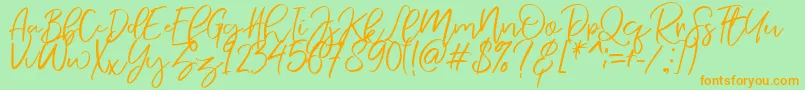 NermolaScript Regular Font – Orange Fonts on Green Background