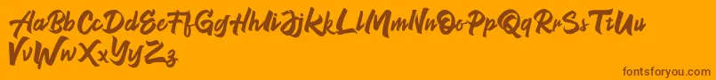 NeverEnding Free Version-fontti – ruskeat fontit oranssilla taustalla