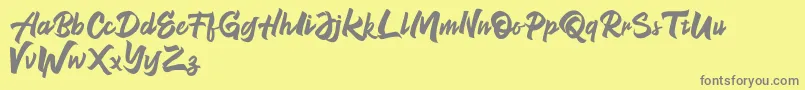NeverEnding Free Version-Schriftart – Graue Schriften auf gelbem Hintergrund
