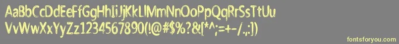 Nicholazzo Font – Yellow Fonts on Gray Background